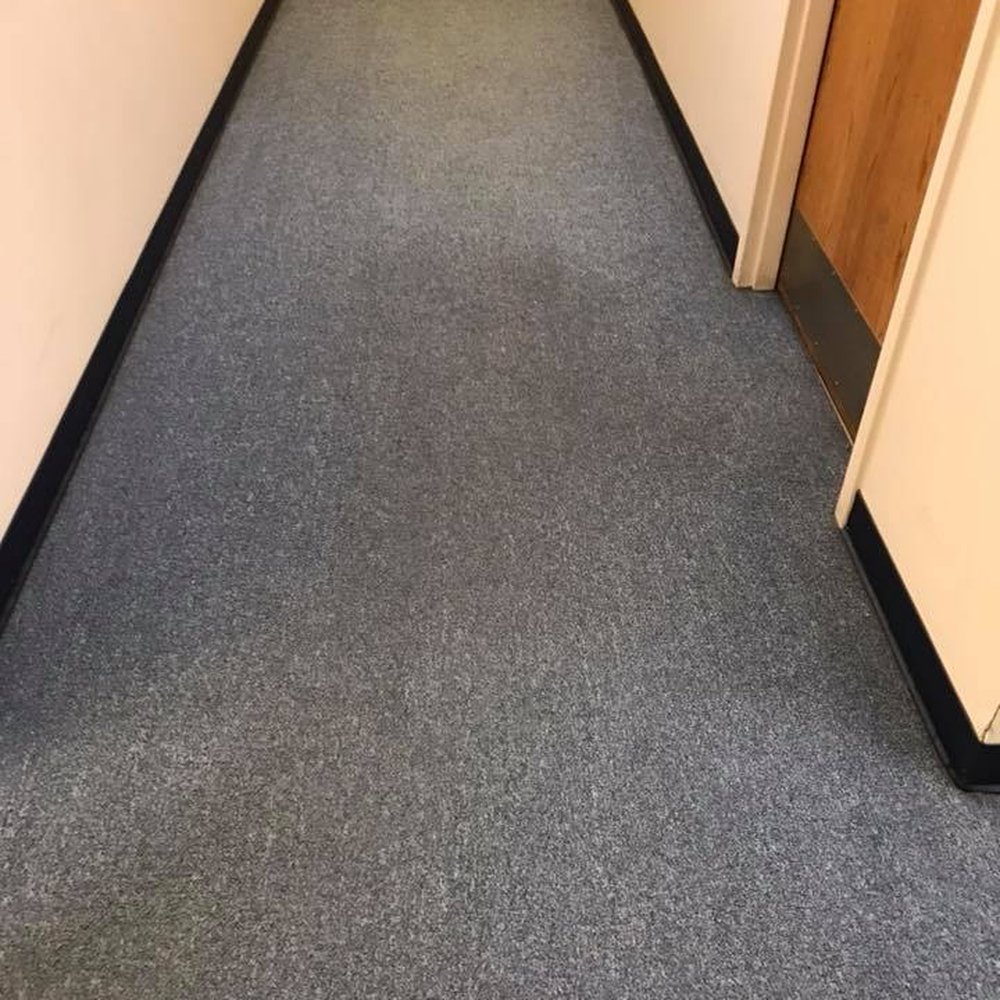 Carpeted office corridor maintained for a Carlsbad business property